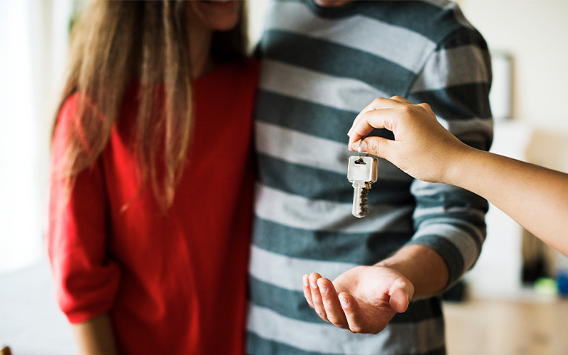 Couple being handed house keys