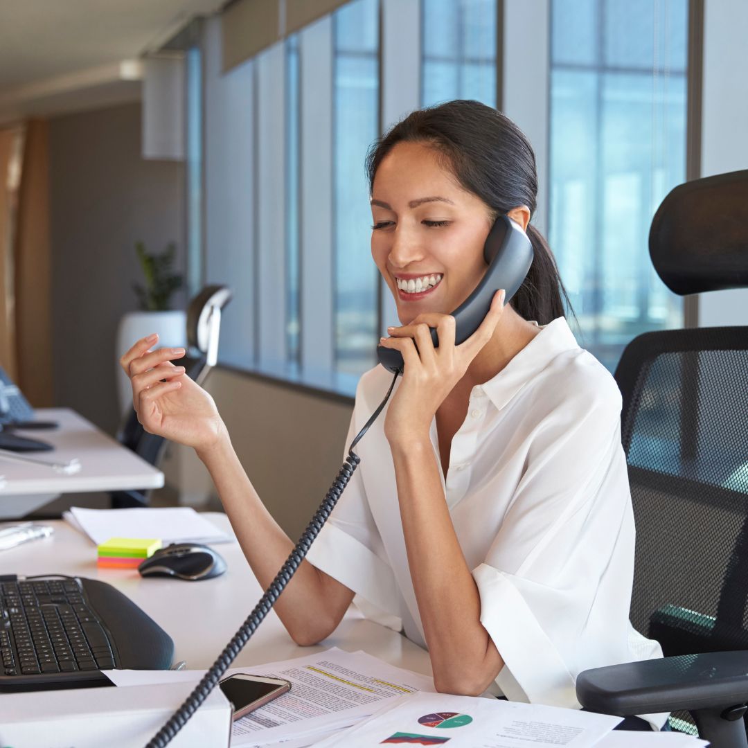 professional woman making a phone call in office