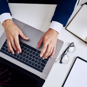 person typing on laptop