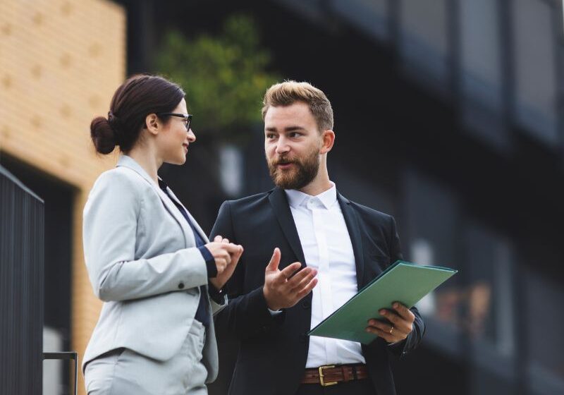 business associates talking outside